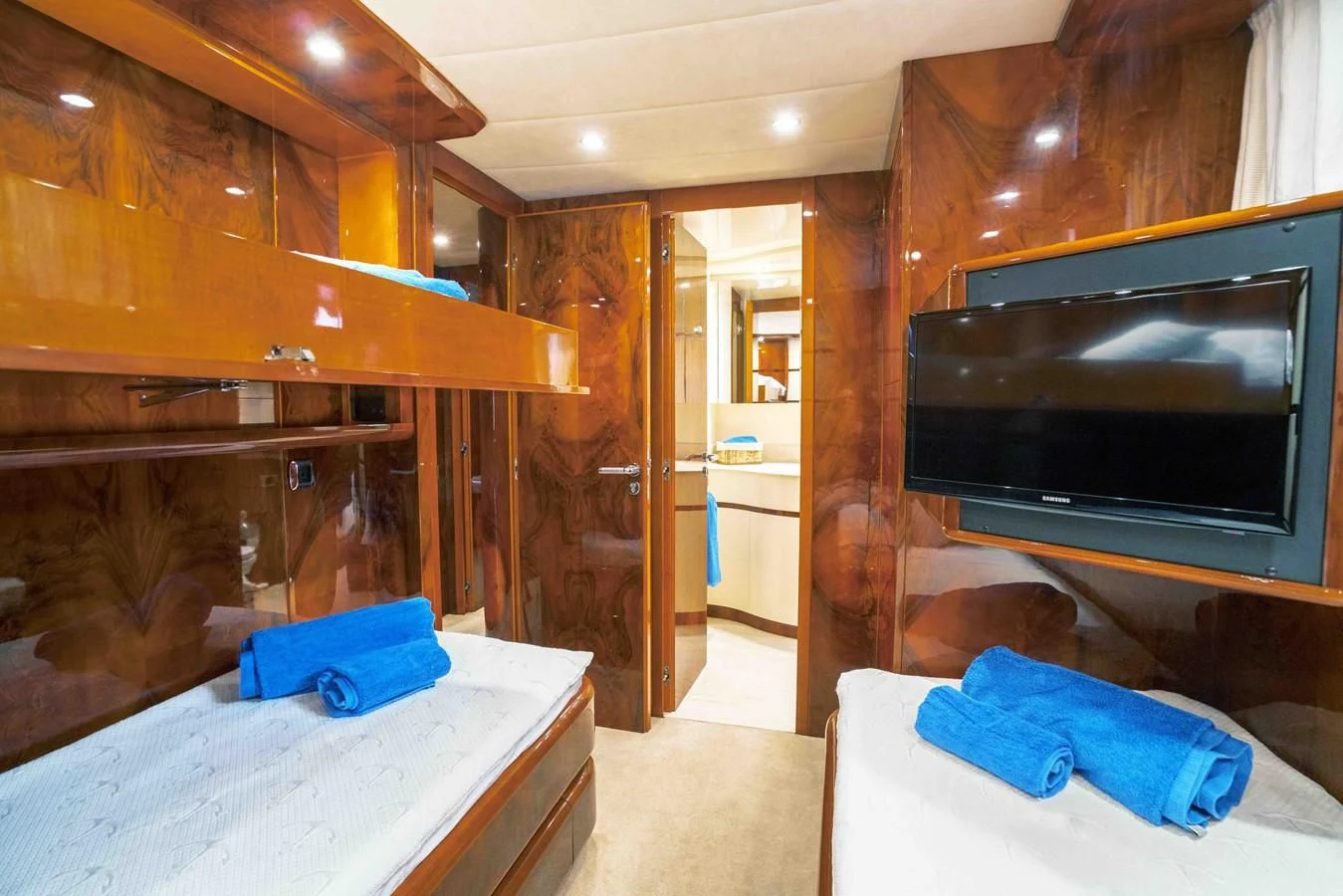 a room with a fireplace and a bed aboard KIAWAH II Yacht for Sale