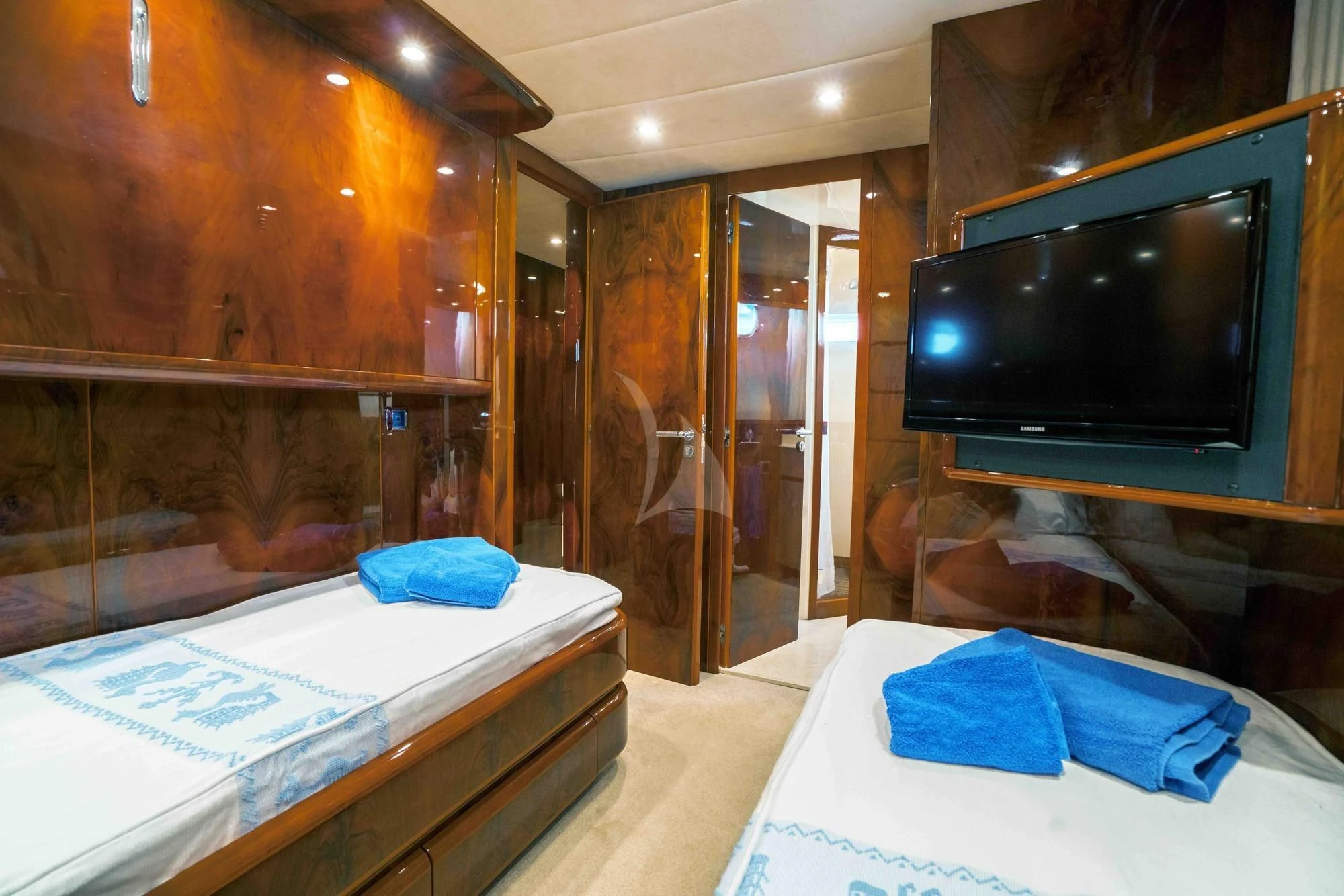 a room with a tv and a bed aboard KIAWAH II Yacht for Sale