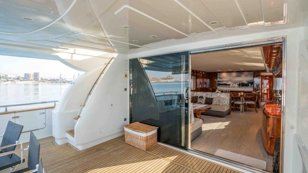 a room with a bed and a couch aboard KIAWAH II Yacht for Sale