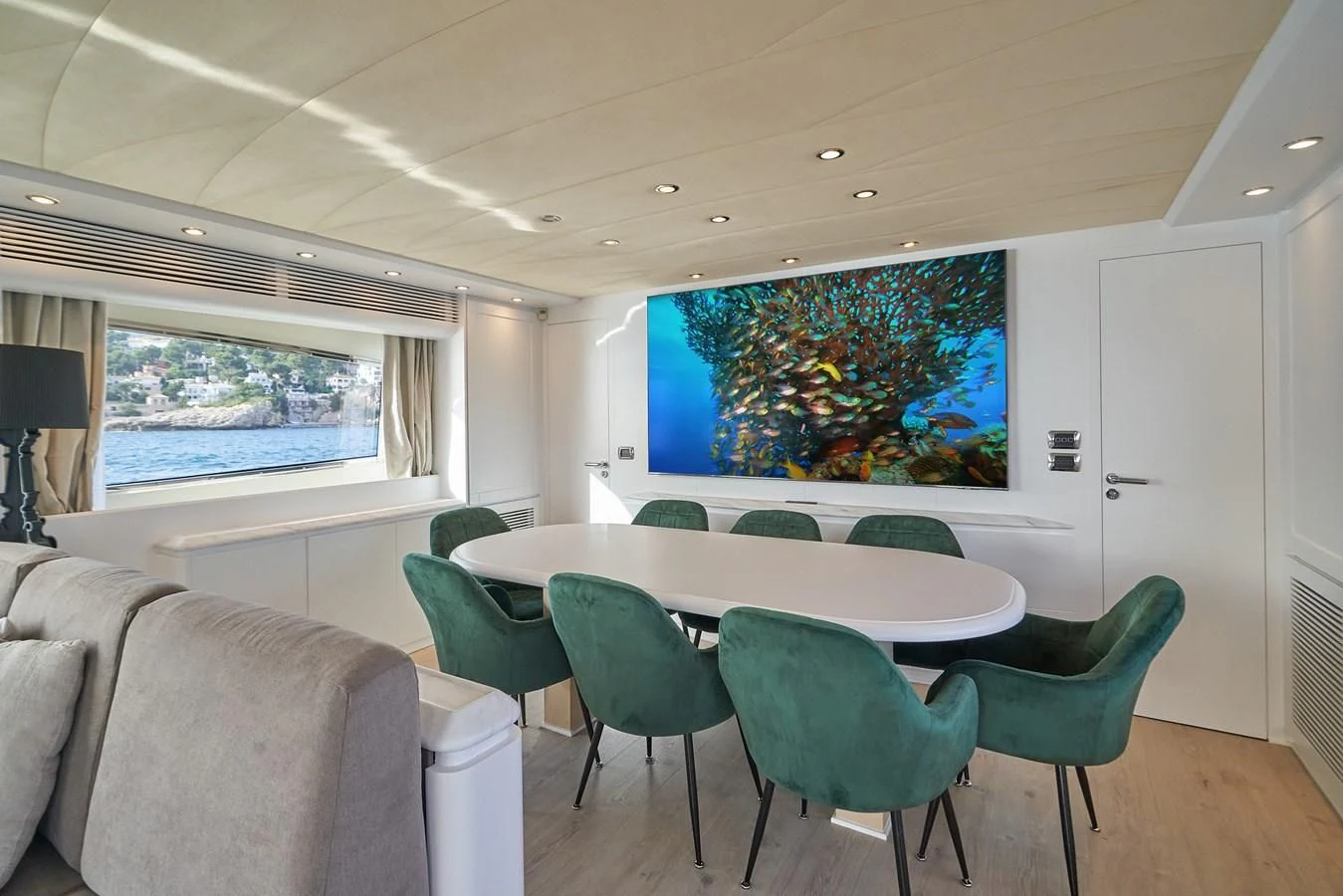 a room with a table and chairs aboard KIAWAH II Yacht for Sale