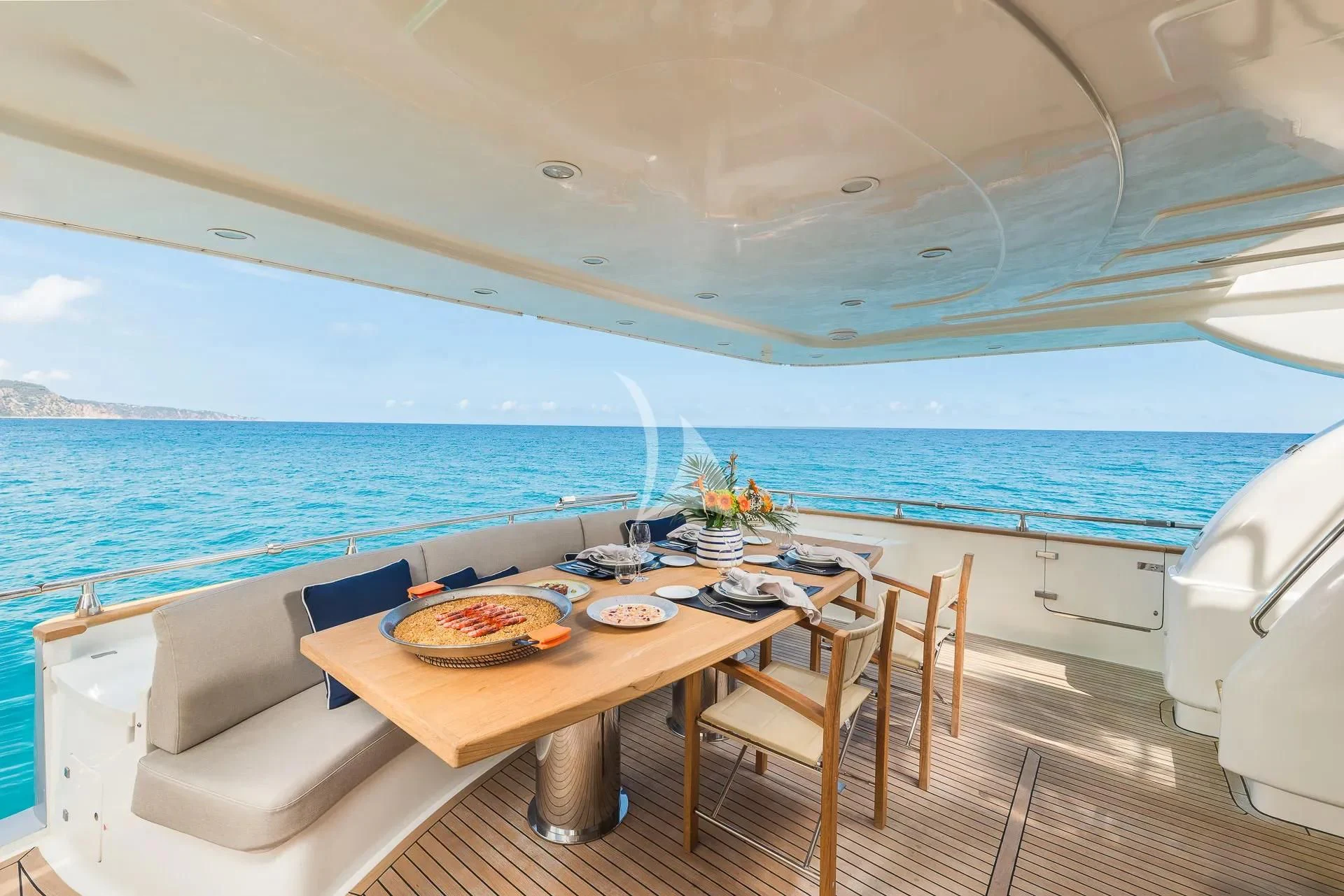 a boat with a table and chairs aboard KIAWAH II Yacht for Sale