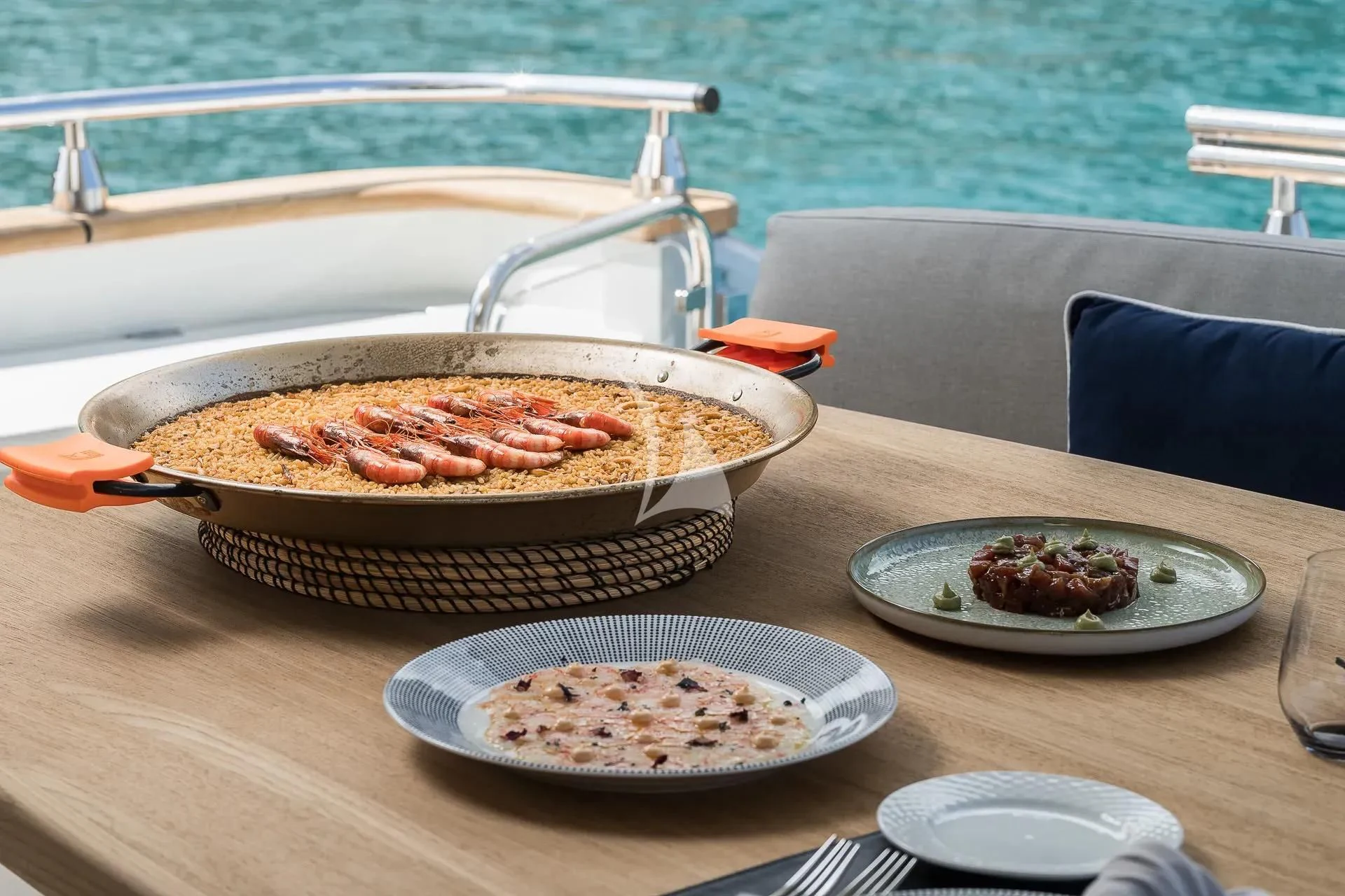 pizzas on plates on a table aboard KIAWAH II Yacht for Sale