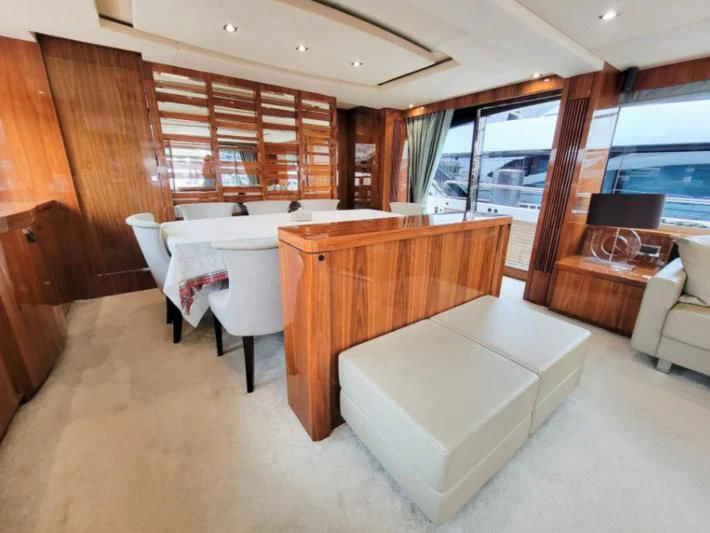 a room with a bed and a table aboard MY LILY Yacht for Sale