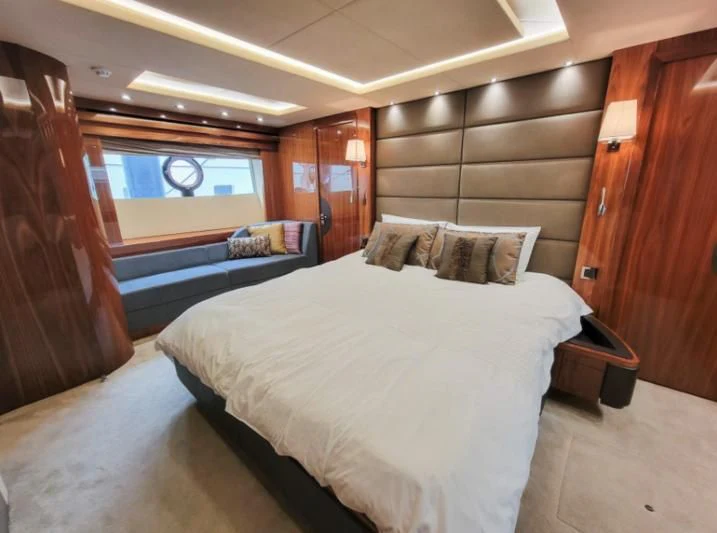 a room with a bed and a wood door aboard MY LILY Yacht for Sale