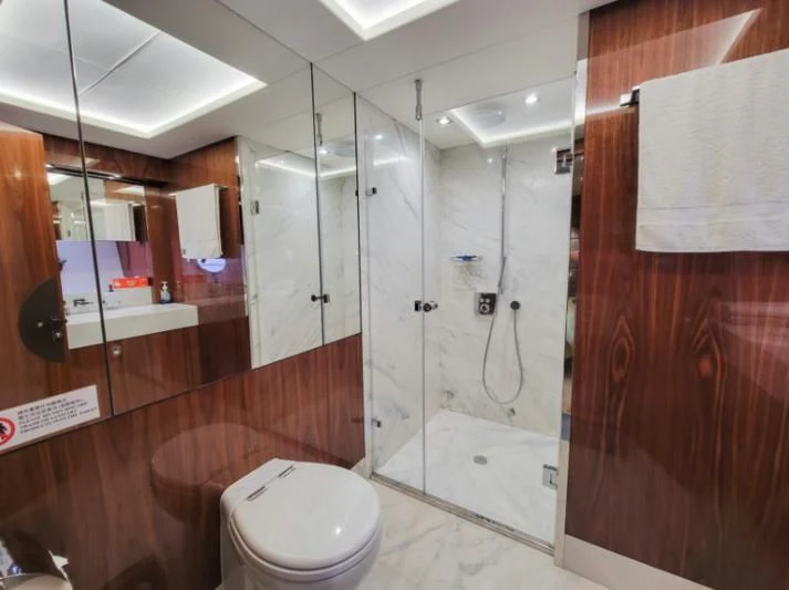 a bathroom with a toilet and a sink aboard MY LILY Yacht for Sale