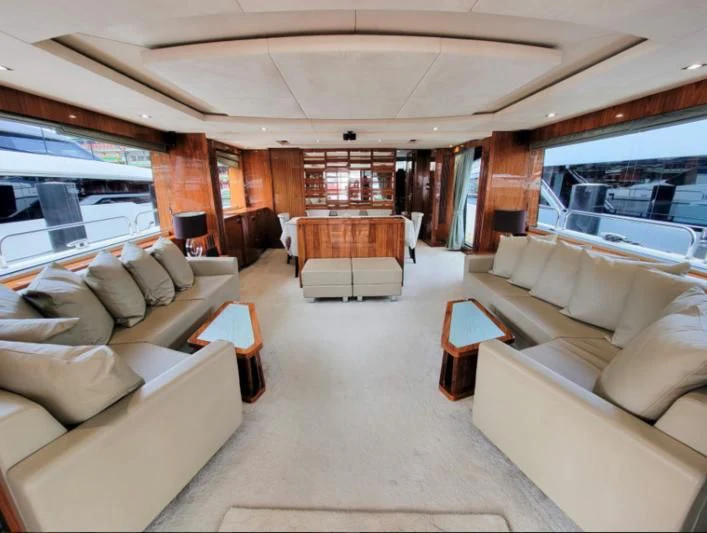 a living room with a large window aboard MY LILY Yacht for Sale