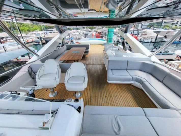 a deck with a deck and a view of a city aboard MY LILY Yacht for Sale