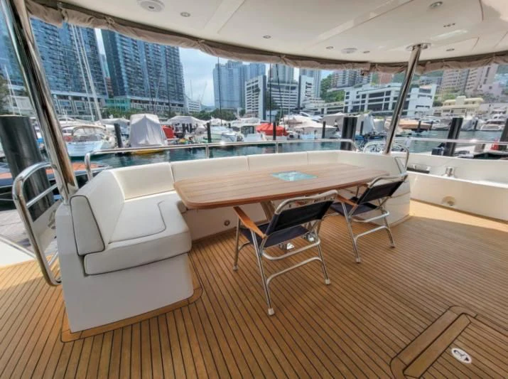 a room with a table and chairs aboard MY LILY Yacht for Sale