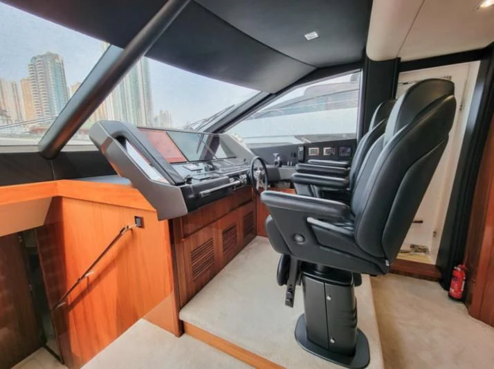 a car with a seat and a desk in the back aboard MY LILY Yacht for Sale