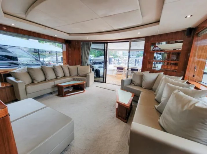 a living room with a large window aboard MY LILY Yacht for Sale