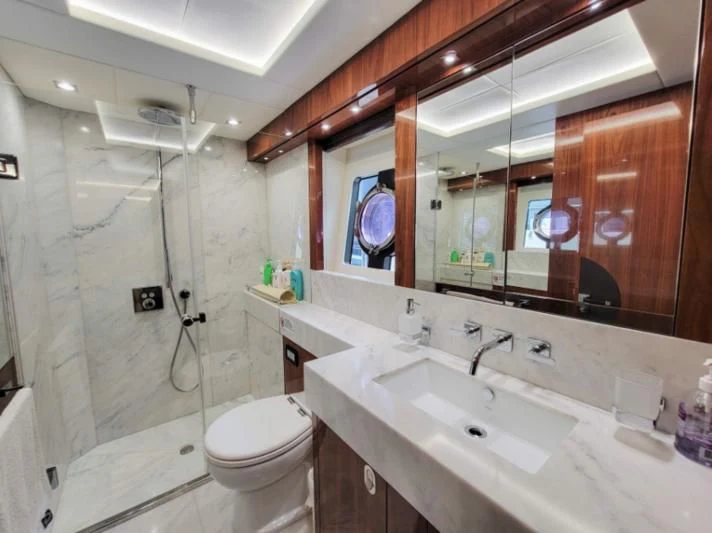a bathroom with a large mirror aboard MY LILY Yacht for Sale