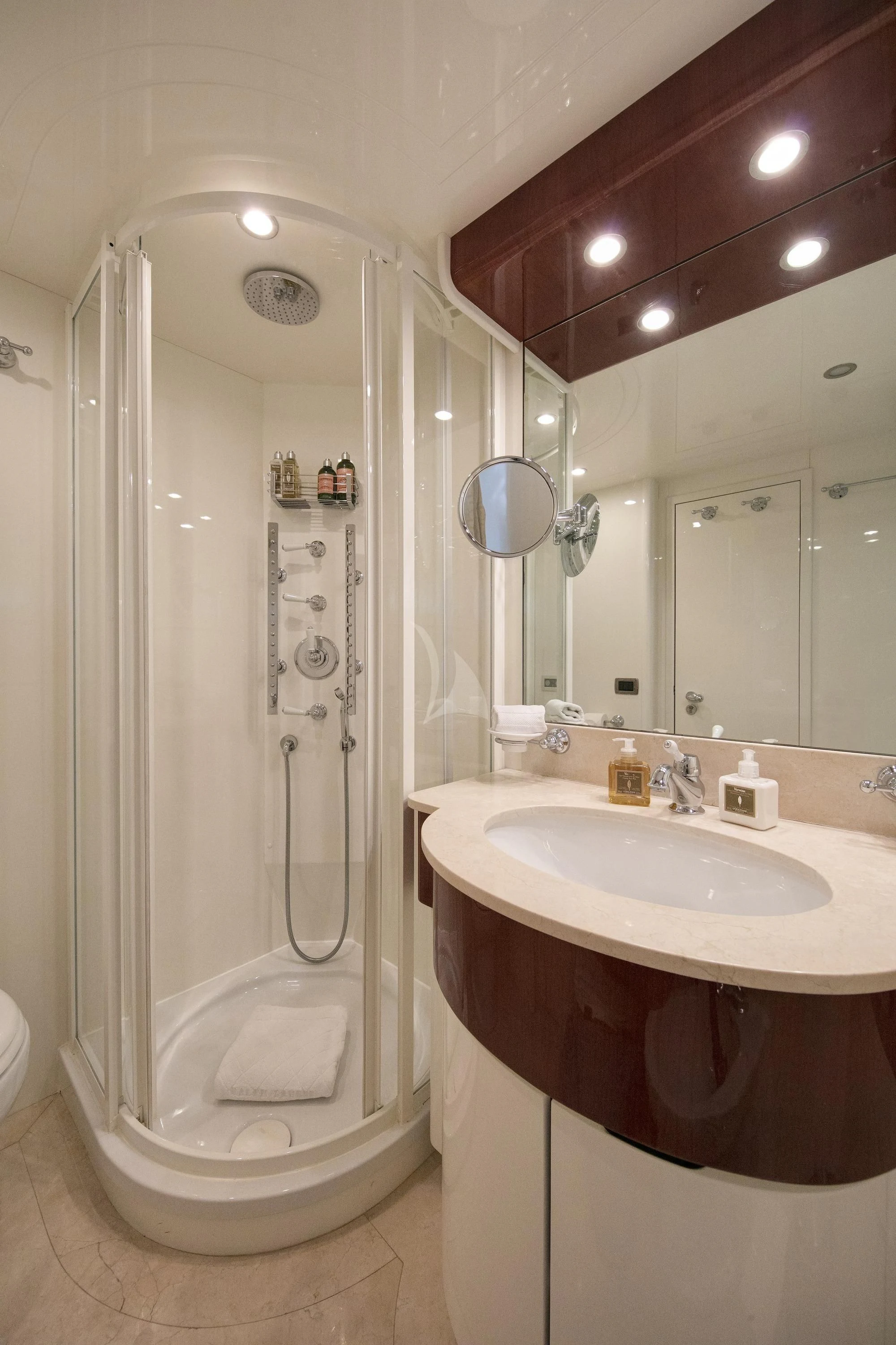 a bathroom with a shower and sink aboard YLANG YLANG Yacht for Sale