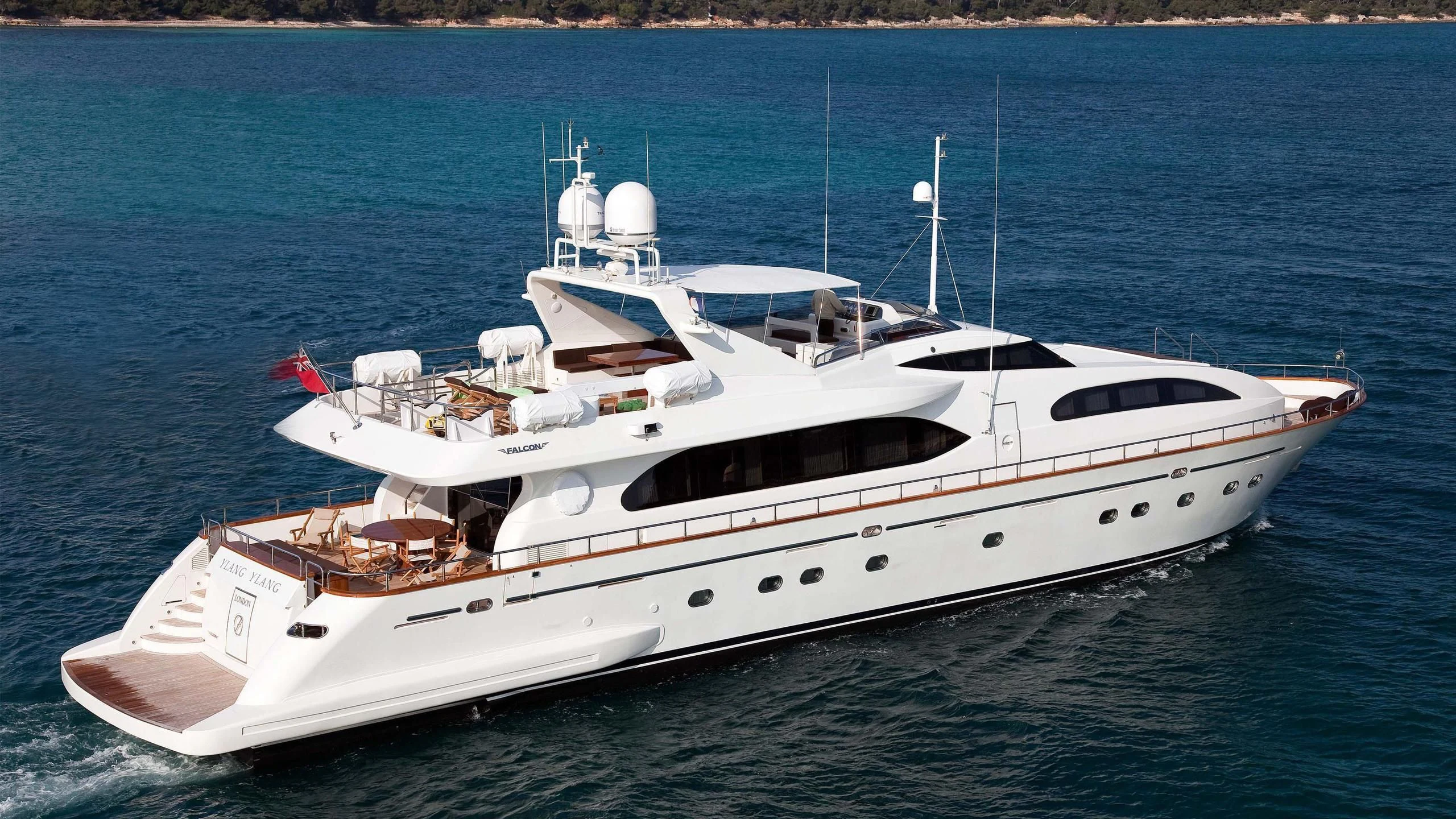 a white yacht on the water aboard YLANG YLANG Yacht for Sale