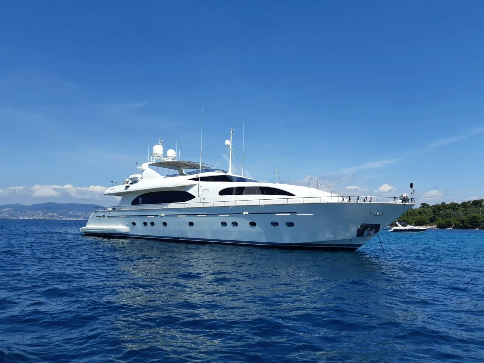 a white yacht on the water aboard YLANG YLANG Yacht for Sale
