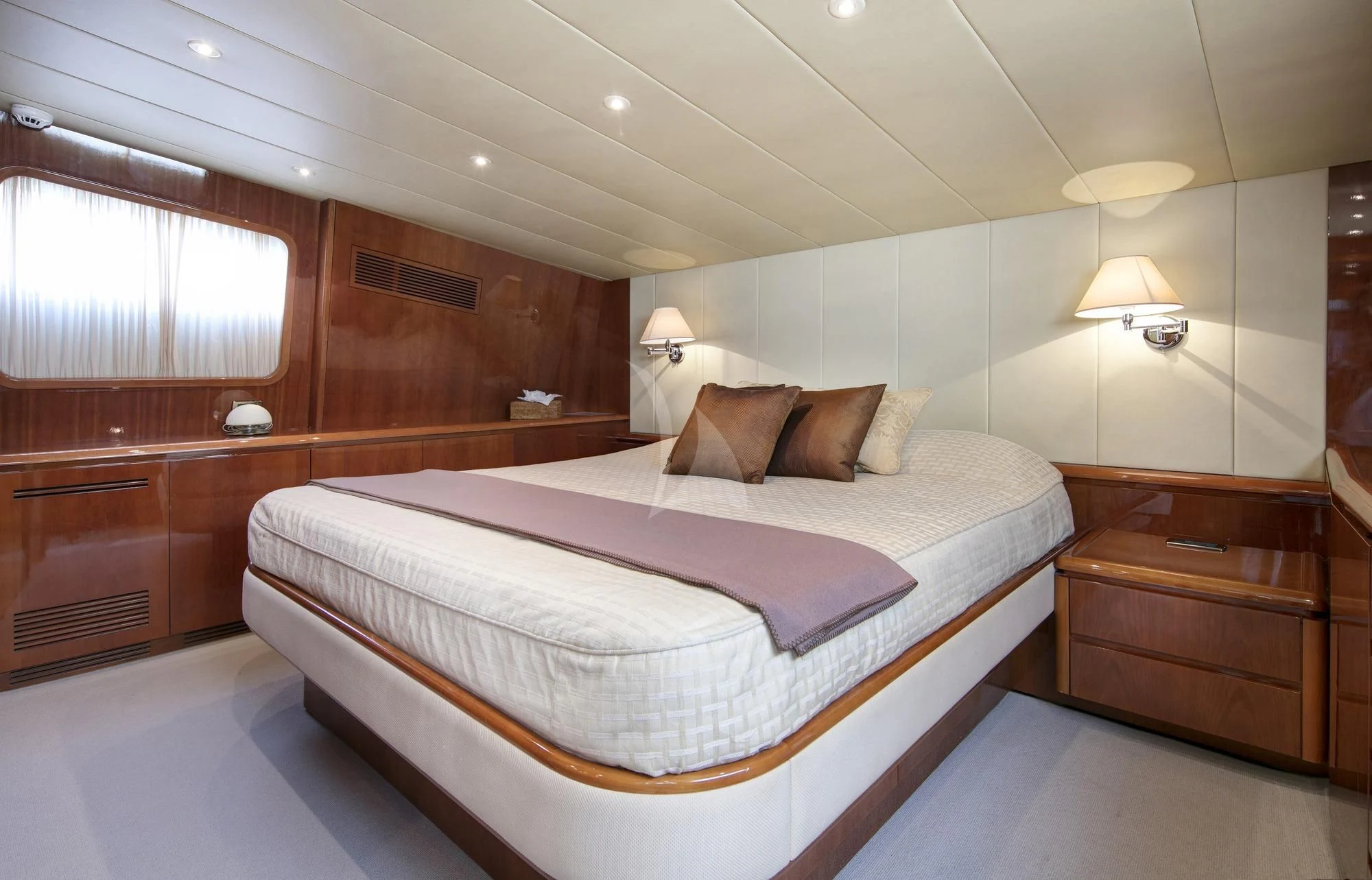 a large bed in a room aboard YLANG YLANG Yacht for Sale