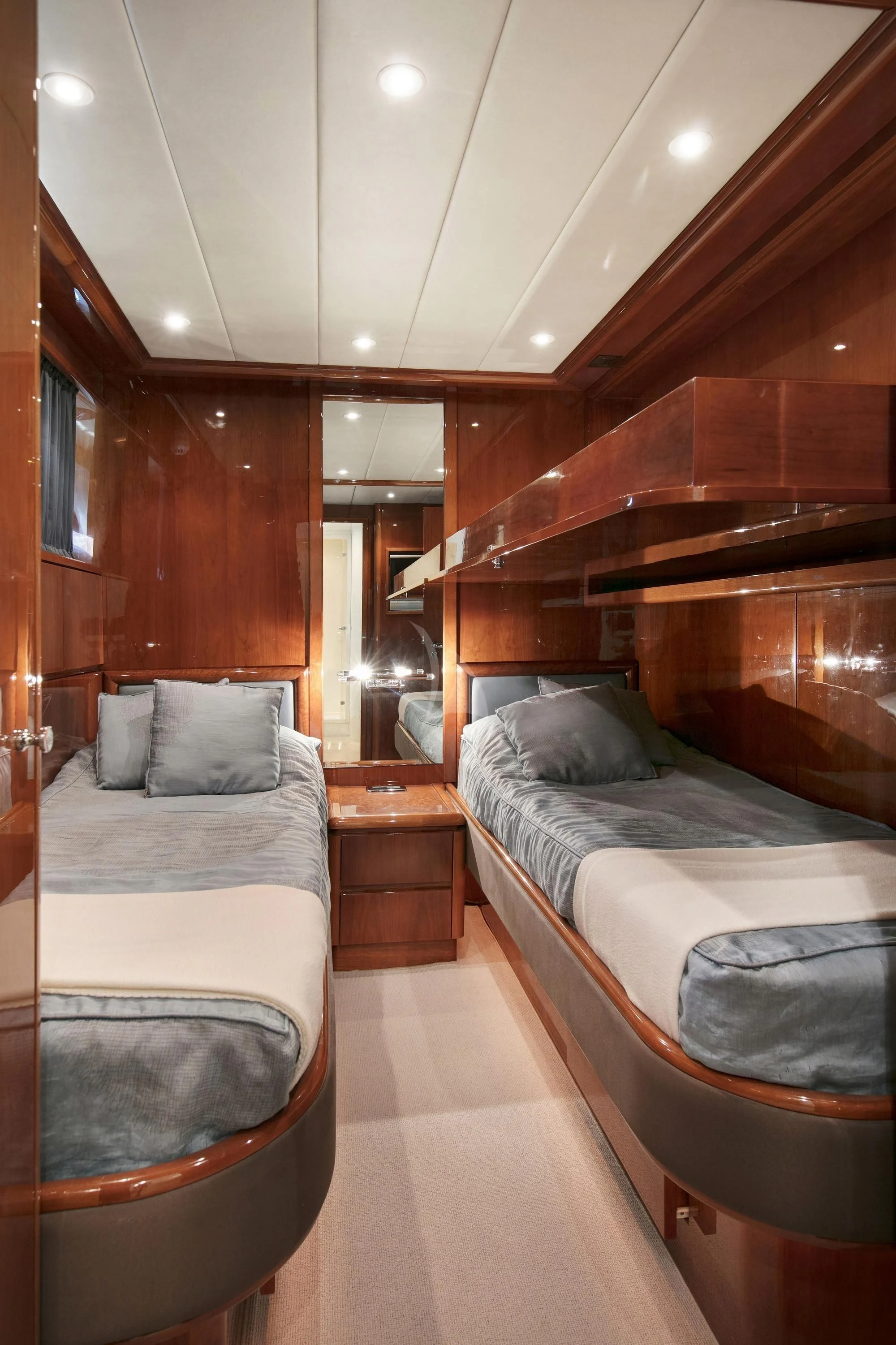 a room with a couple of beds aboard YLANG YLANG Yacht for Sale