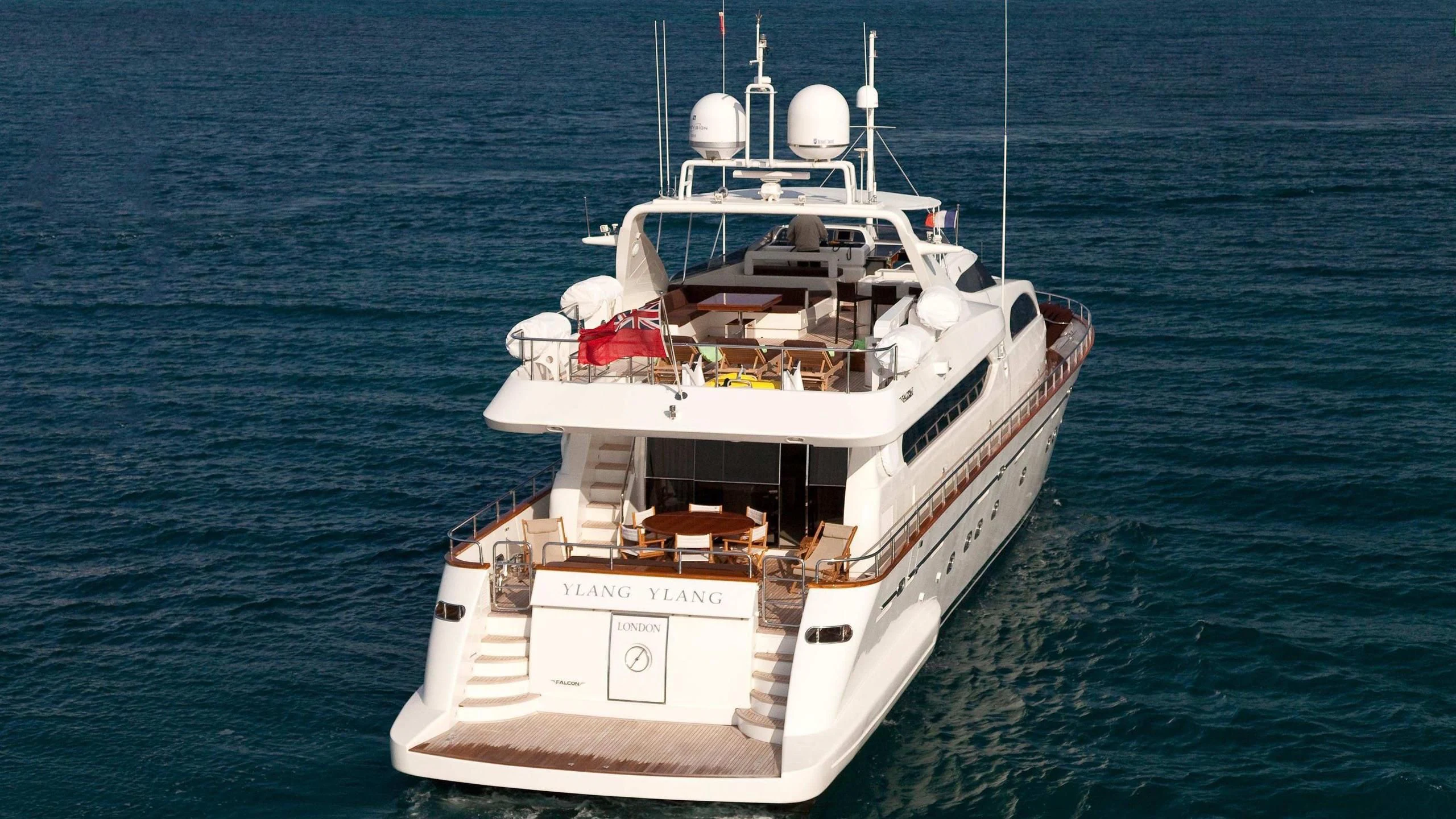 a large white boat in the water aboard YLANG YLANG Yacht for Sale