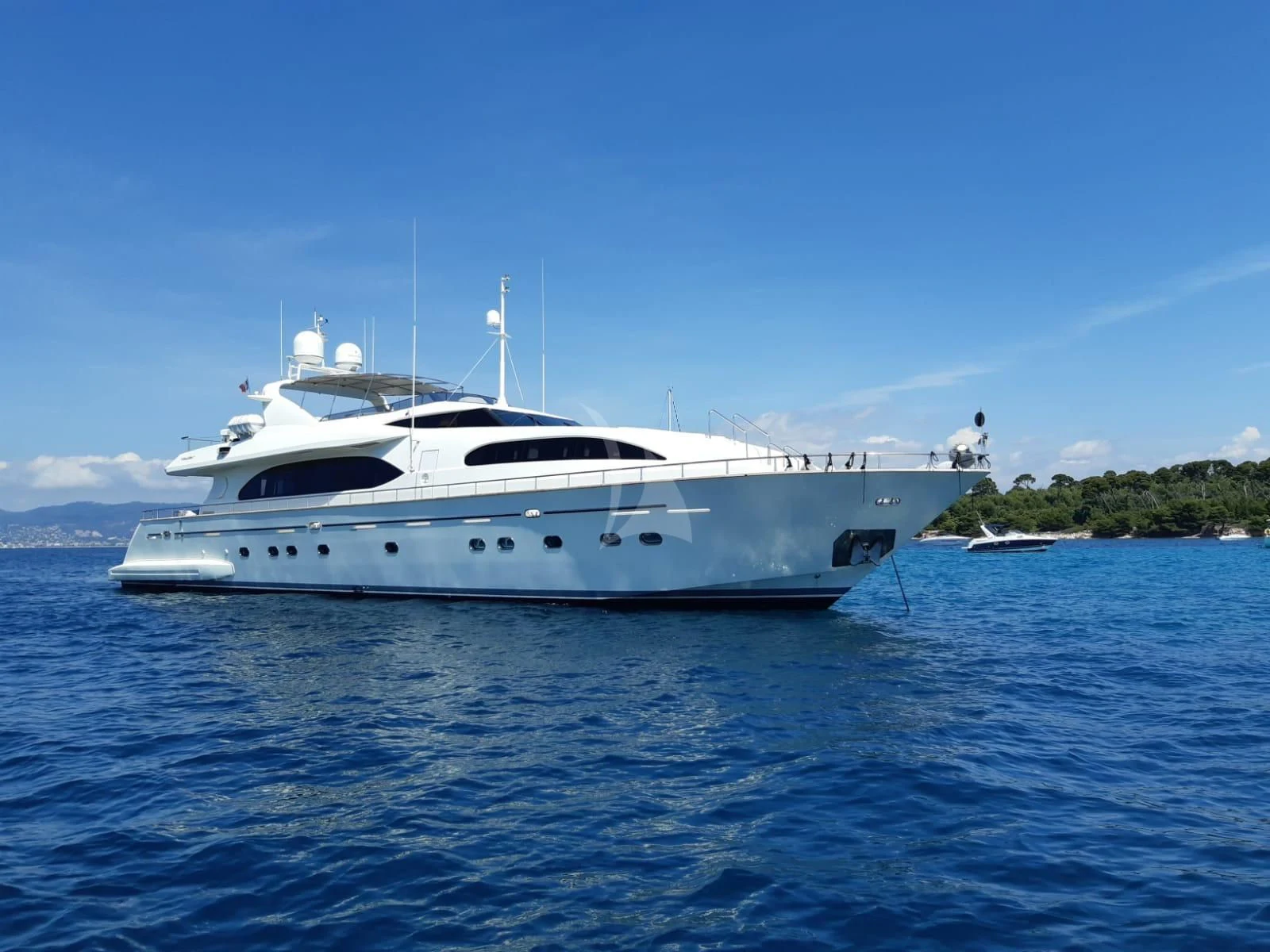 a white yacht in the water aboard YLANG YLANG Yacht for Sale