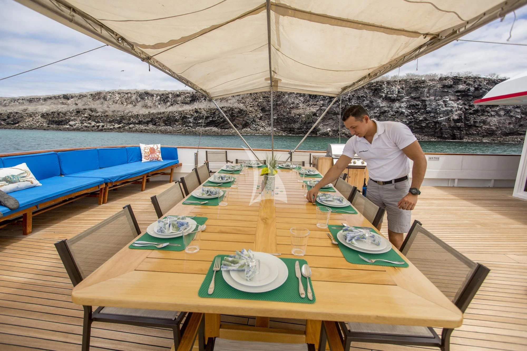 a person preparing food on a table aboard M/Y PASSION Yacht for Sale