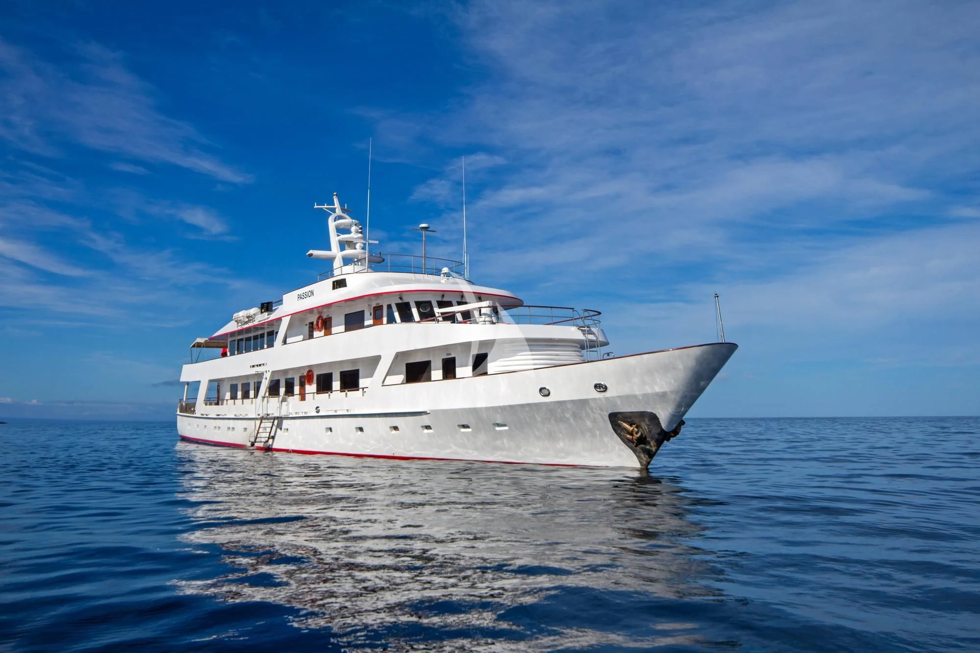 a large white boat in the water aboard M/Y PASSION Yacht for Sale