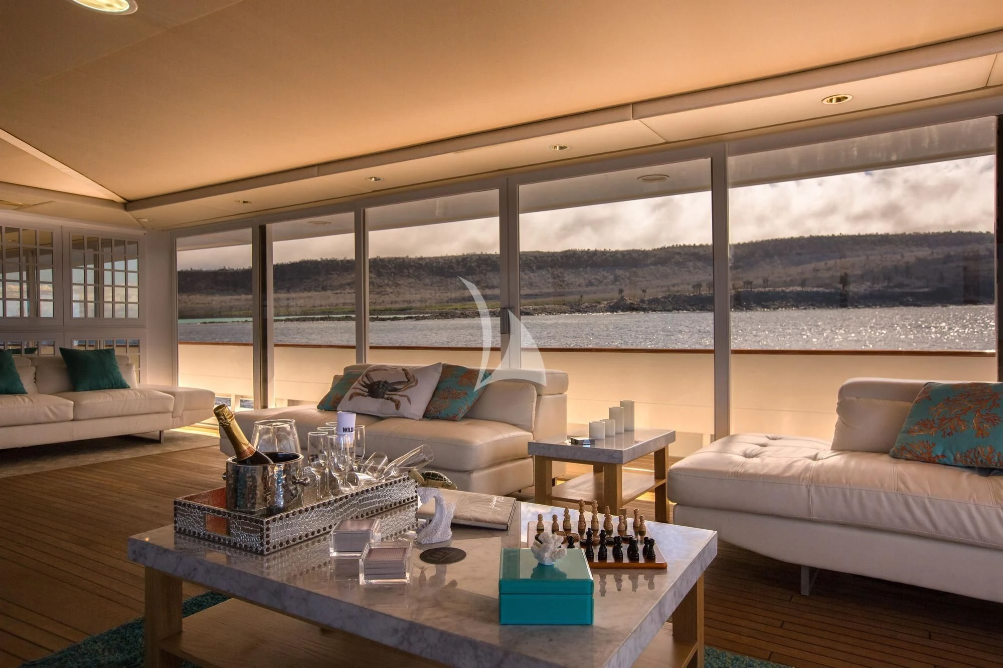 a room with a table and couches aboard M/Y PASSION Yacht for Sale