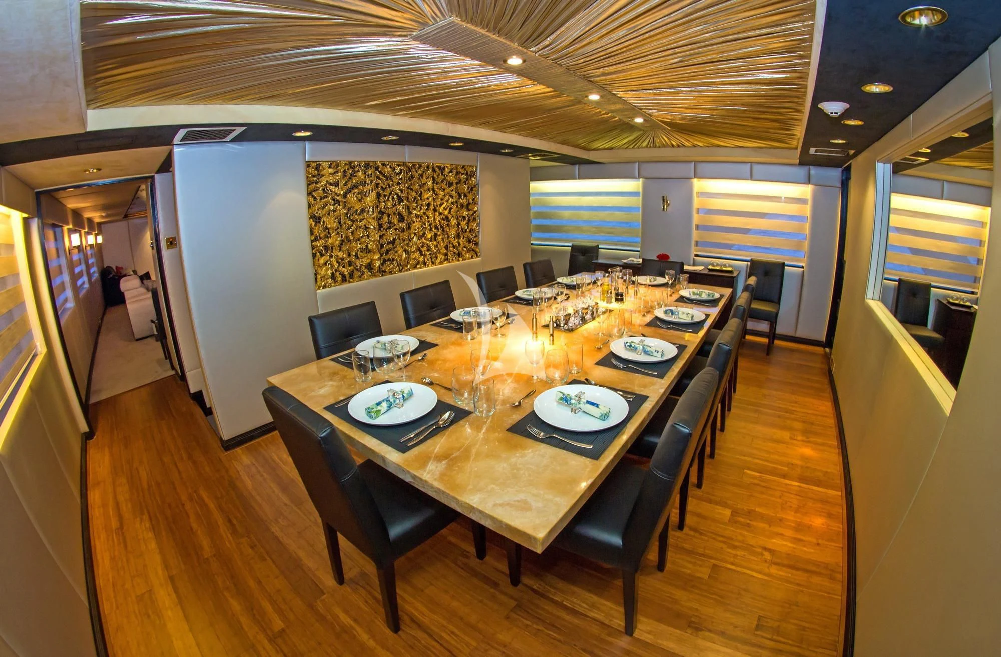 a large kitchen with a dining table aboard M/Y PASSION Yacht for Sale