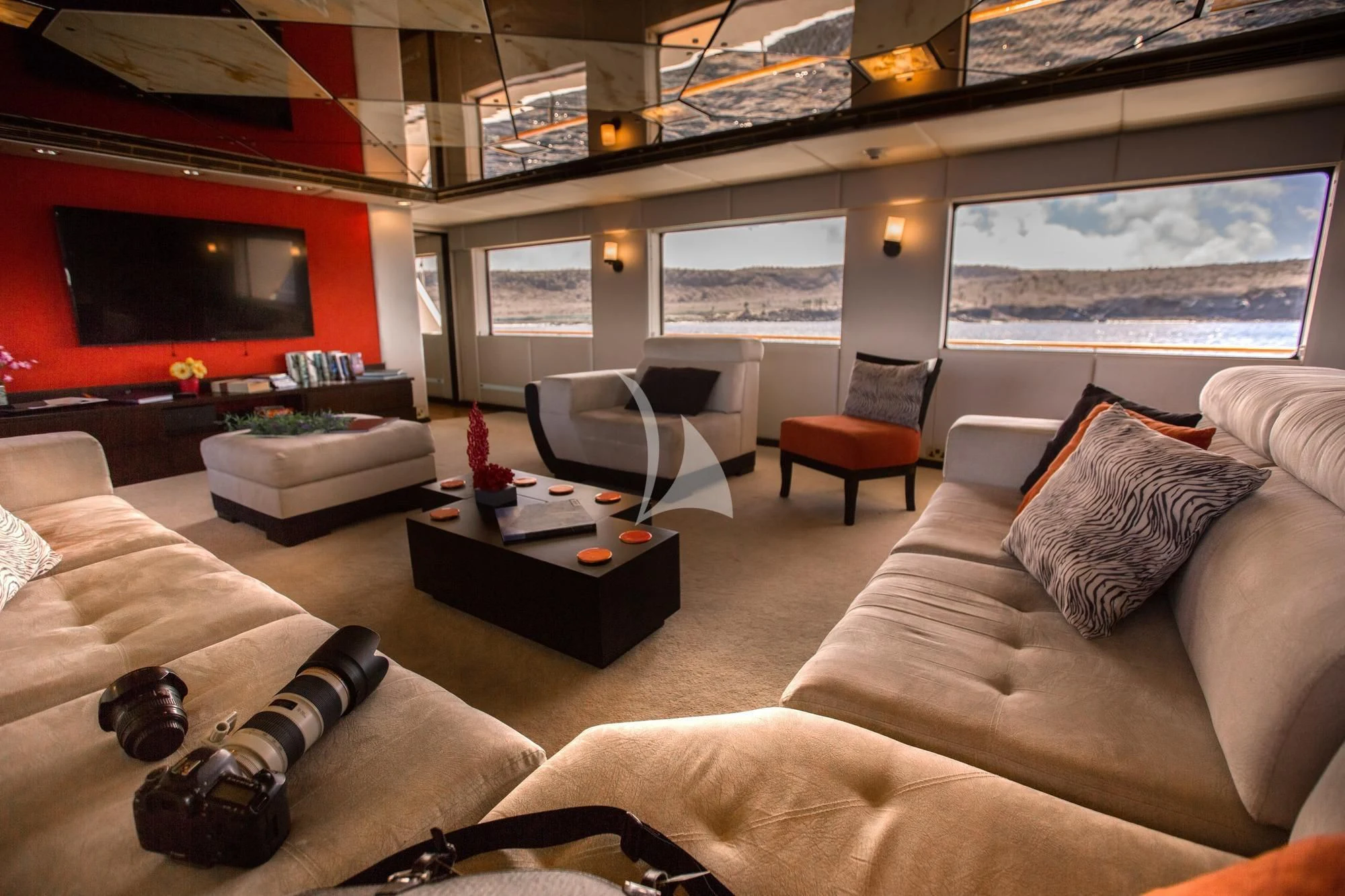 a living room with a large window aboard M/Y PASSION Yacht for Sale