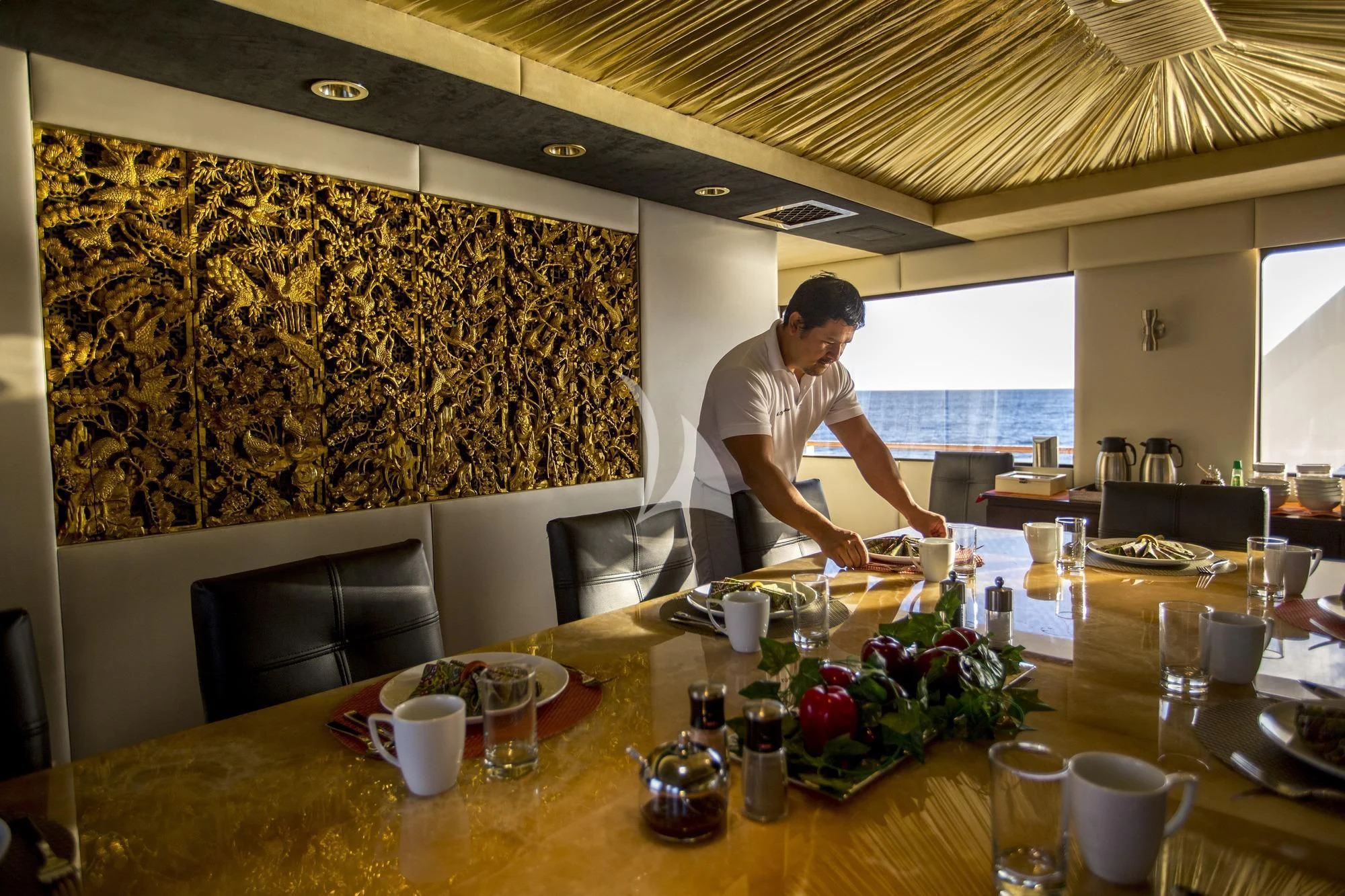 a person sitting at a table aboard M/Y PASSION Yacht for Sale