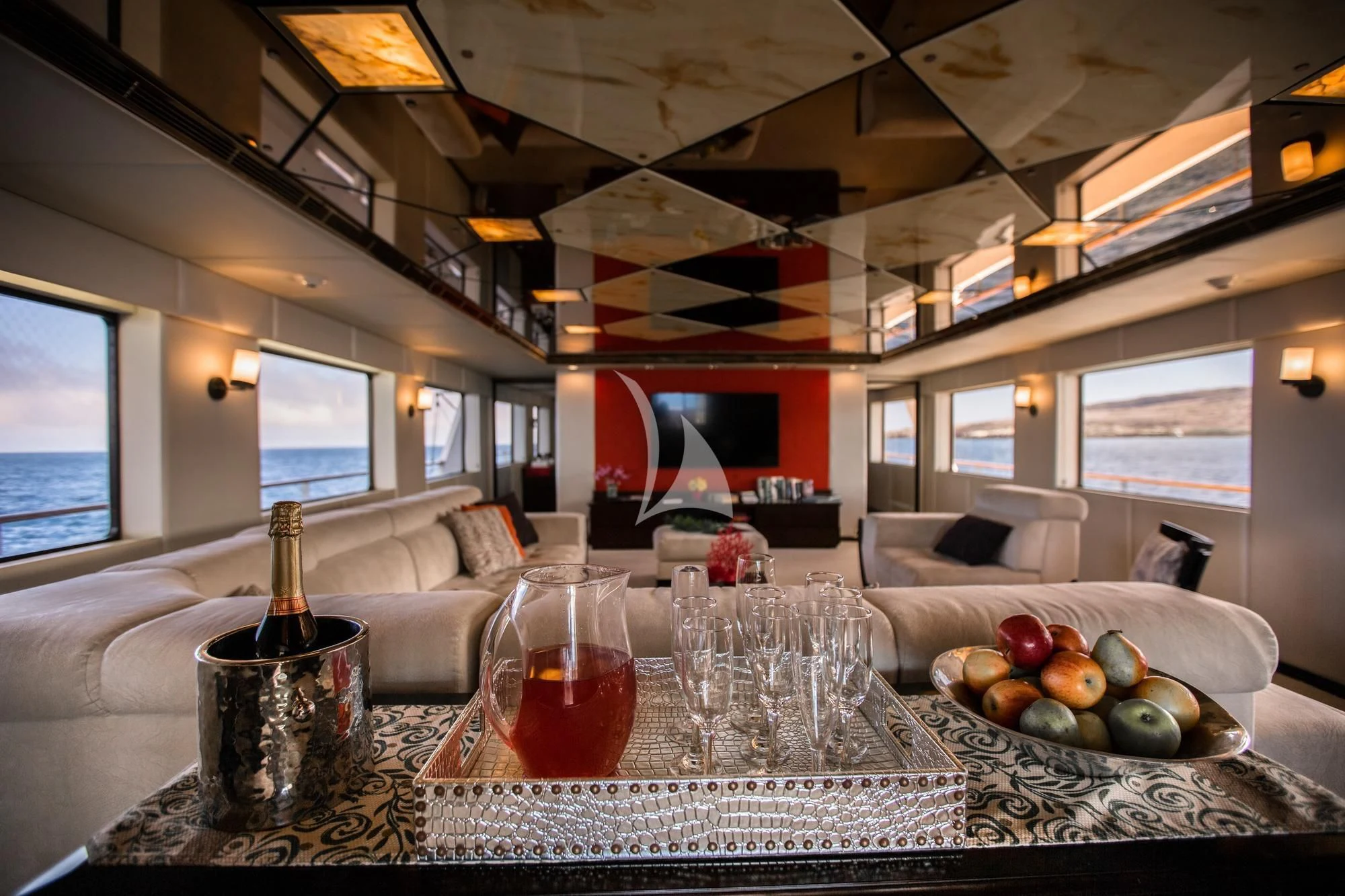 a table with wine glasses and fruit on it aboard M/Y PASSION Yacht for Sale