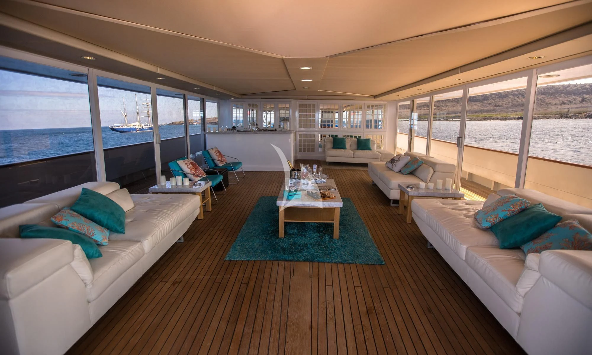 a living room with a large window aboard M/Y PASSION Yacht for Sale