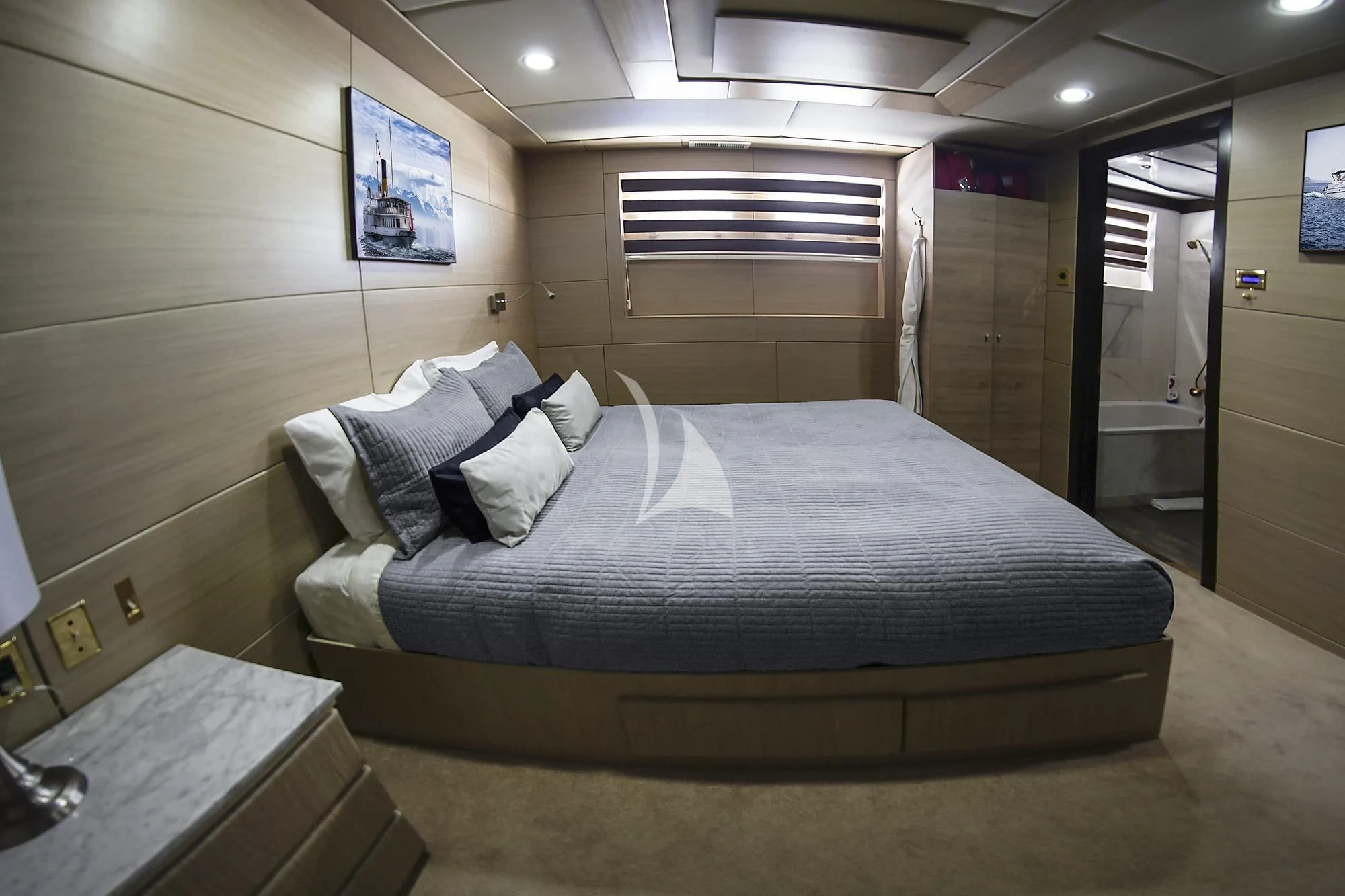 a bed in a room aboard M/Y PASSION Yacht for Sale
