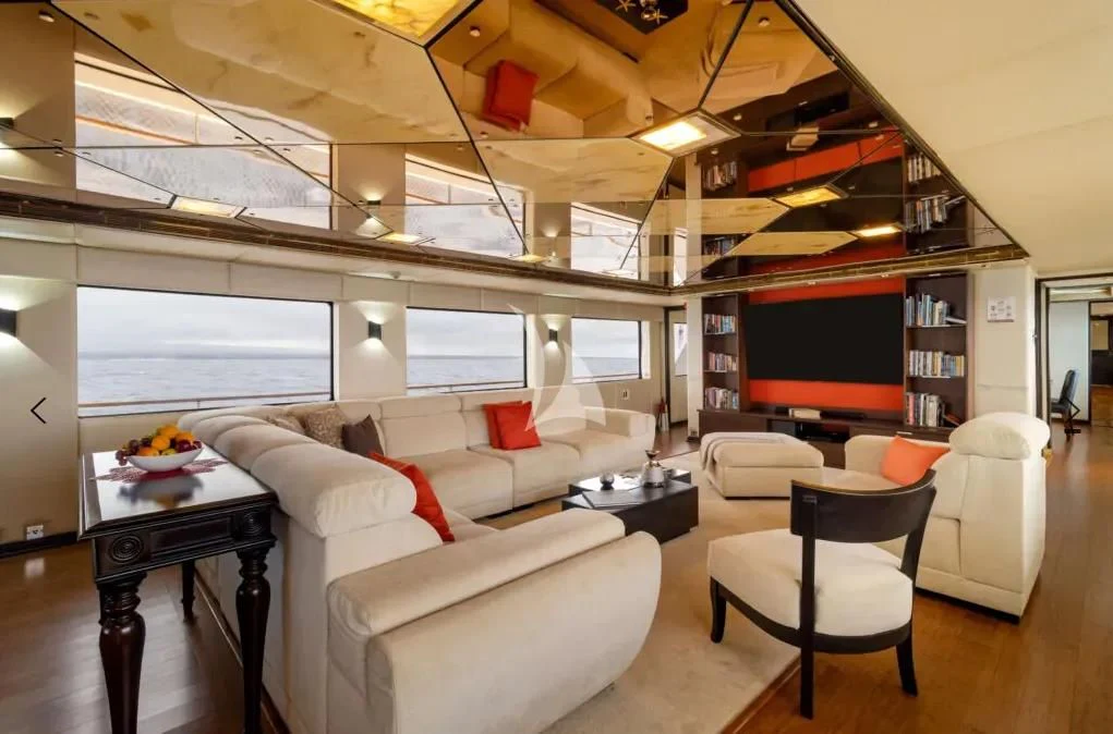 a living room with white couches aboard M/Y PASSION Yacht for Sale
