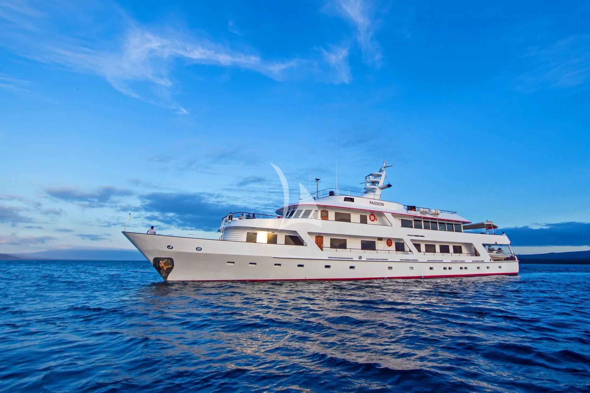 a white yacht in the water aboard M/Y PASSION Yacht for Sale