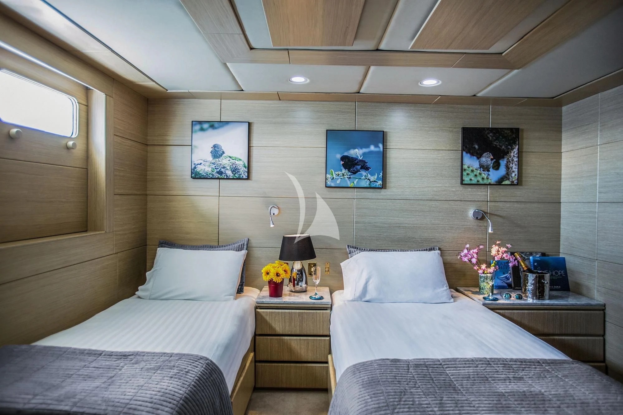 a room with two beds aboard M/Y PASSION Yacht for Sale
