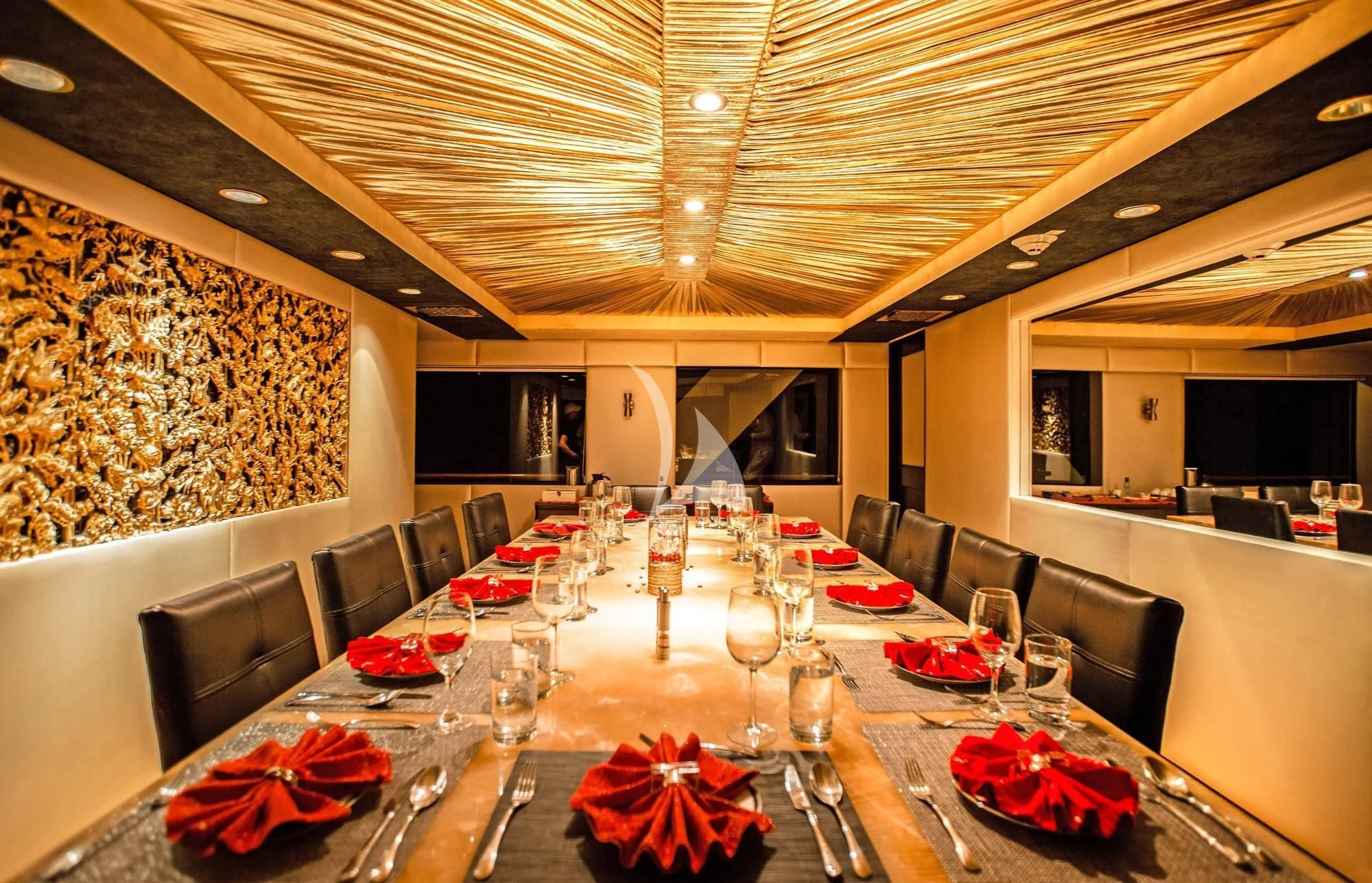 a large room with a table and chairs and a large chandelier aboard M/Y PASSION Yacht for Sale
