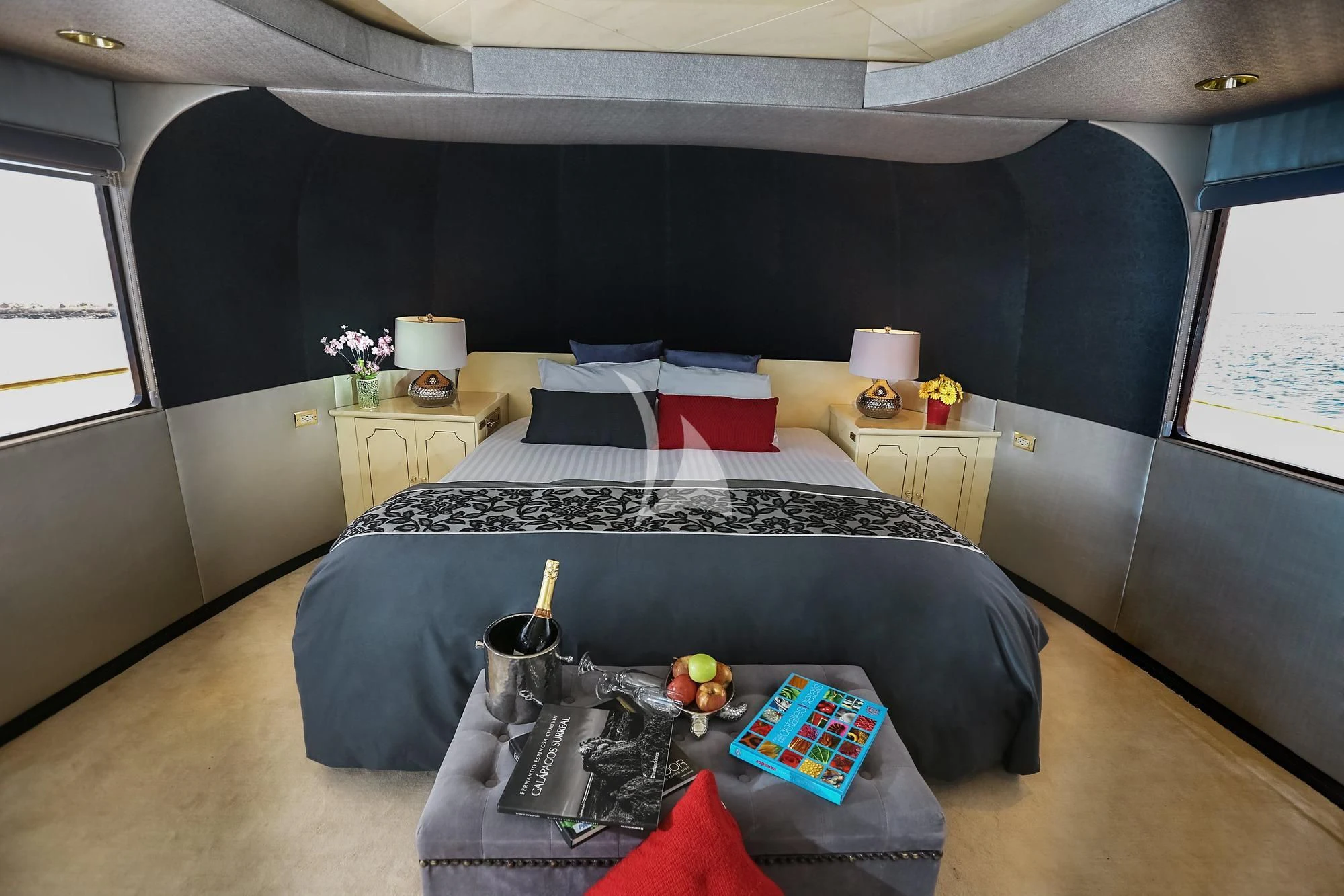 a bedroom with a black bed and black walls aboard M/Y PASSION Yacht for Sale