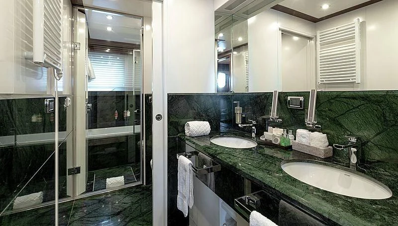 a bathroom with a glass shower aboard W EXPLORER Yacht for Sale