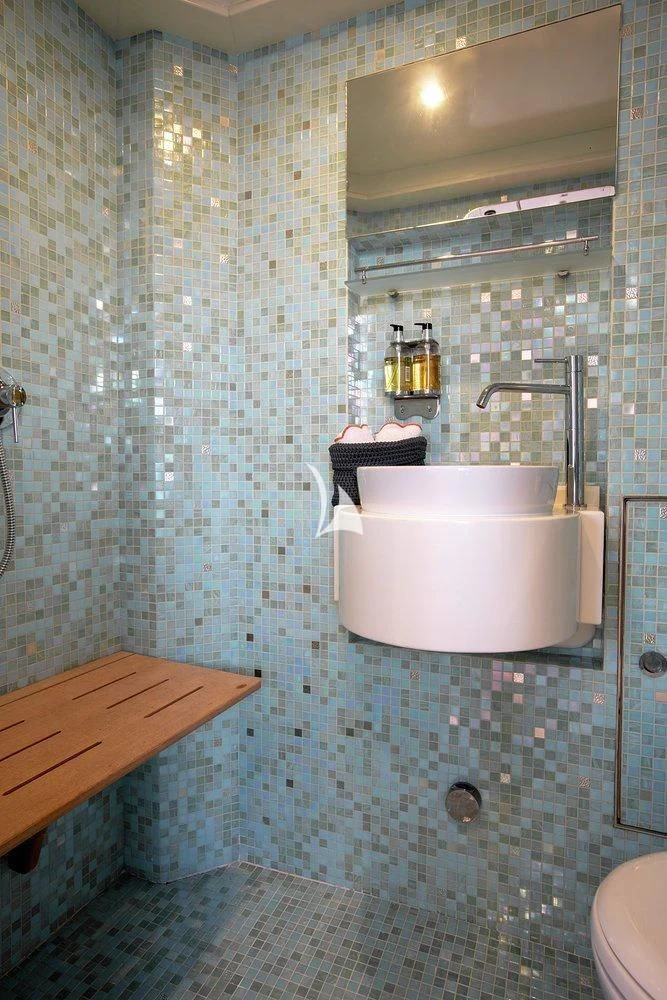 a bathroom with a sink and a mirror aboard W EXPLORER Yacht for Sale