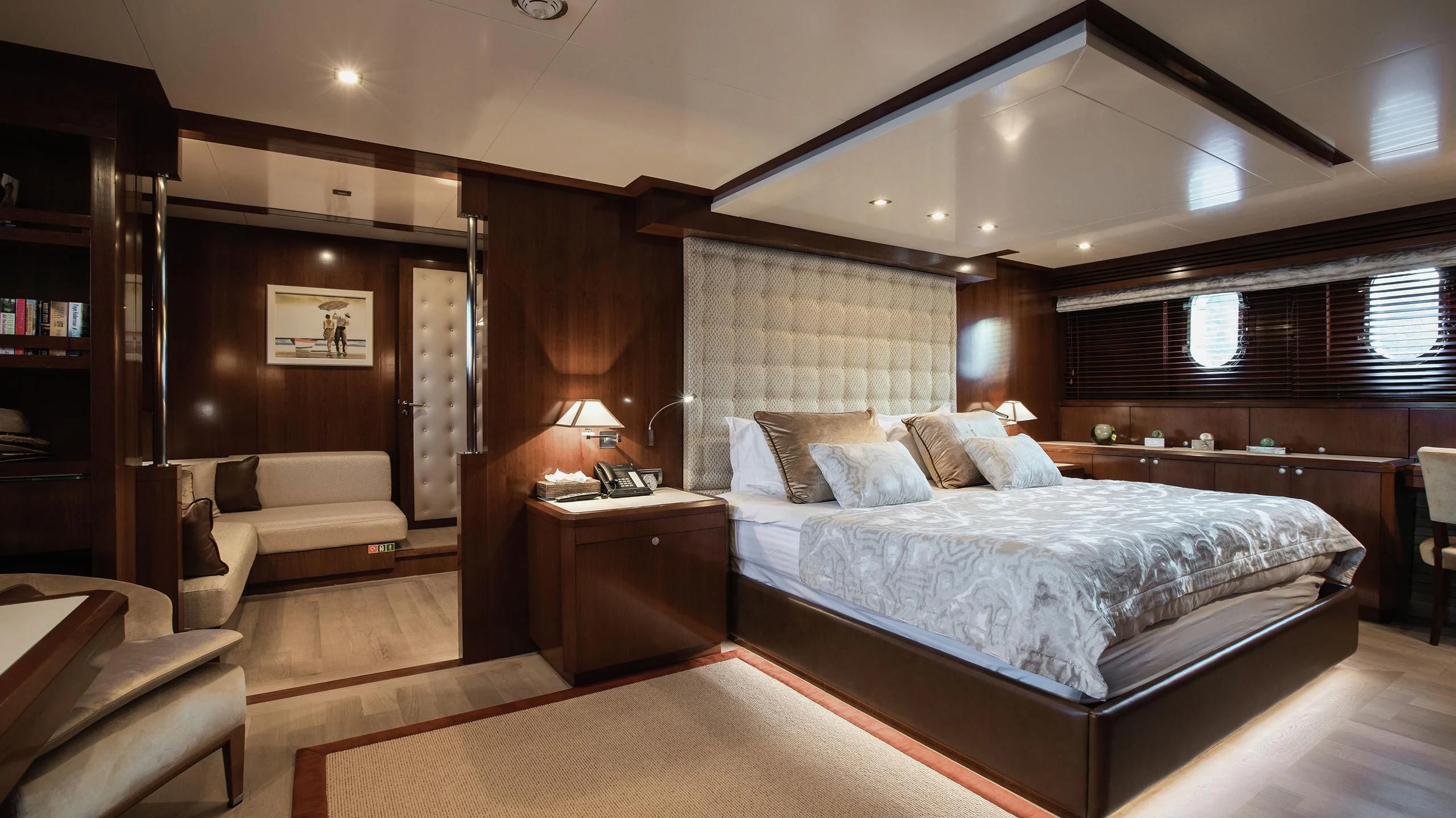a large bedroom with a bed and a couch aboard W EXPLORER Yacht for Sale