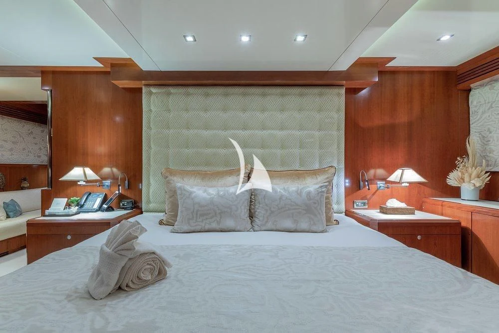 a large bed with white sheets aboard W EXPLORER Yacht for Sale