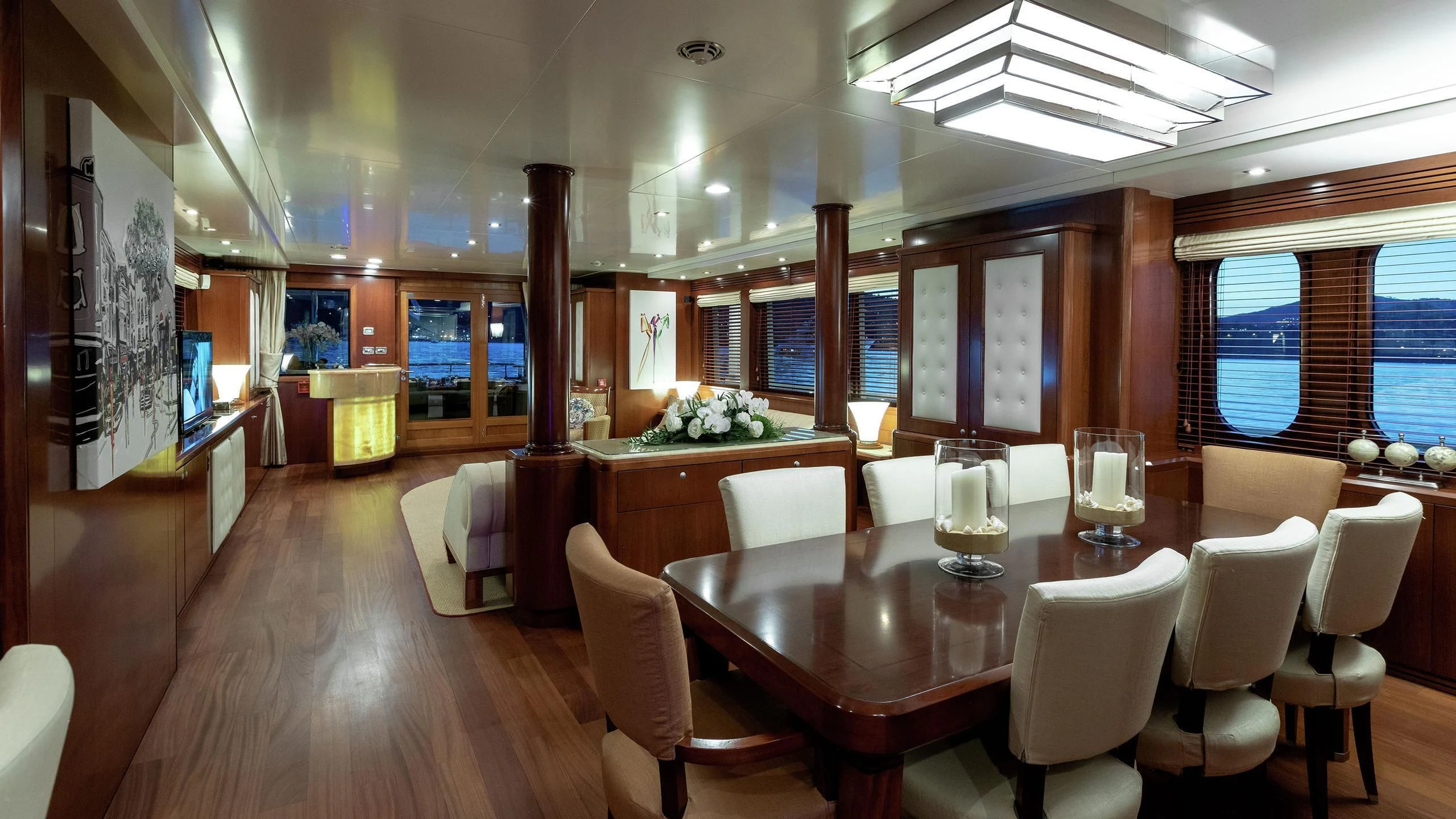 a large room with tables and chairs aboard W EXPLORER Yacht for Sale