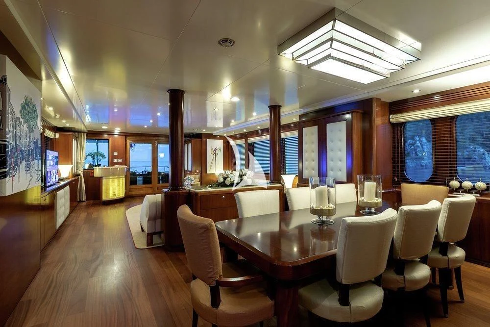 a large room with tables and chairs aboard W EXPLORER Yacht for Sale