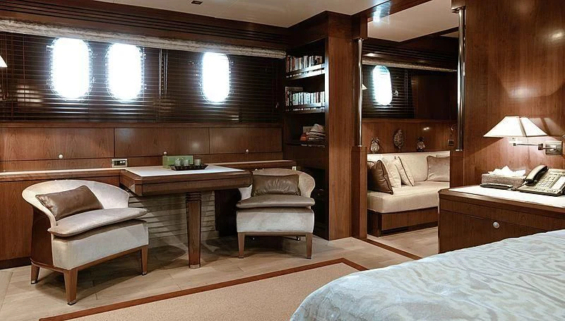 a room with a bed and a desk aboard W EXPLORER Yacht for Sale