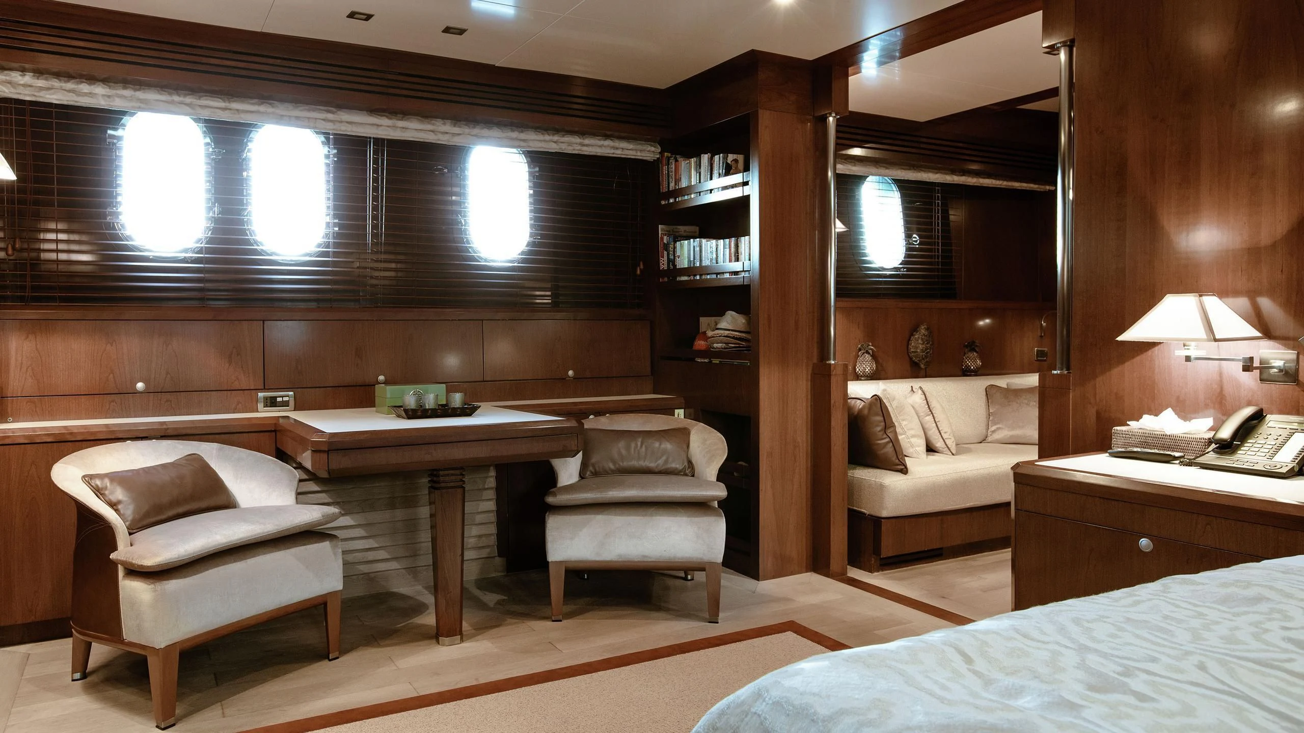 a room with a bed and desk aboard W EXPLORER Yacht for Sale
