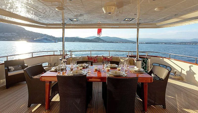 a table set for a meal aboard W EXPLORER Yacht for Sale