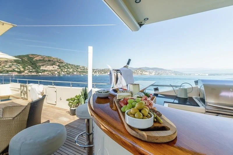 a table with fruit on it aboard W EXPLORER Yacht for Sale
