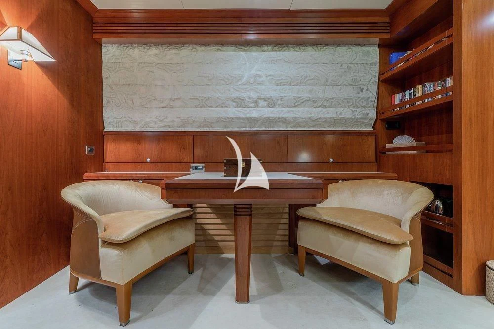 a room with a desk and chairs aboard W EXPLORER Yacht for Sale