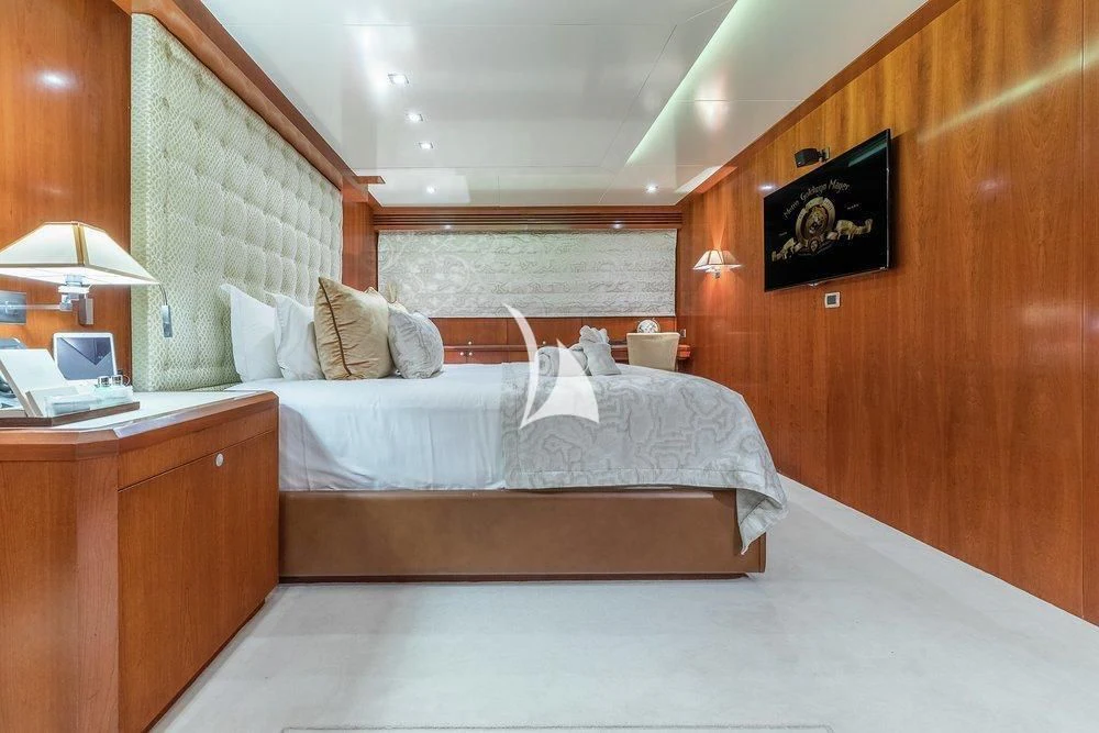 a room with a bed and a desk aboard W EXPLORER Yacht for Sale