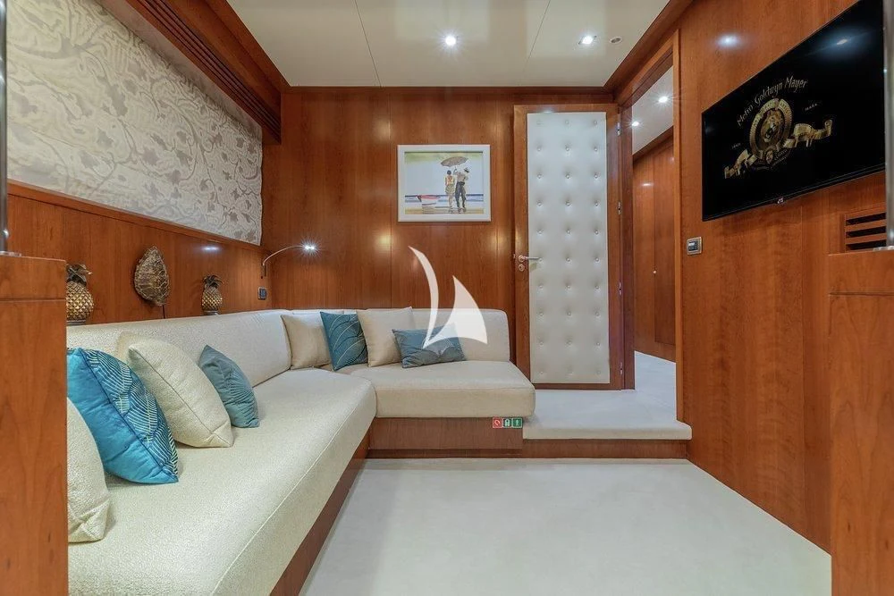 a room with a couch and a bed aboard W EXPLORER Yacht for Sale