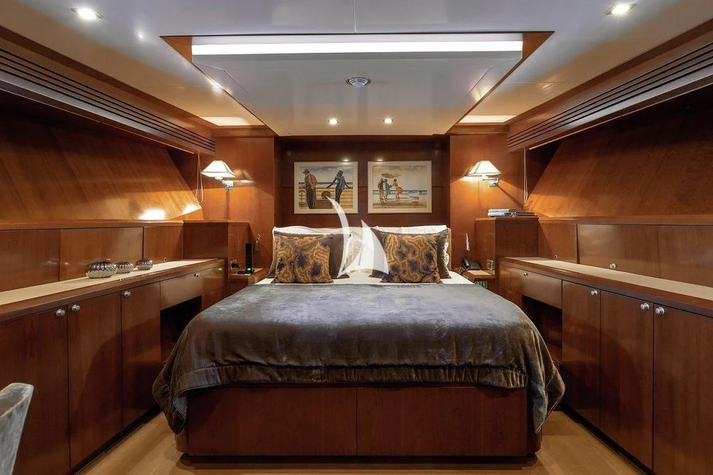 a bed in a room aboard W EXPLORER Yacht for Sale